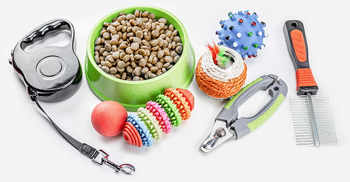Dry food with pets accessories on isolated white